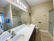 Bathroom featuring a double sink vanity, large mirror and shower with glass doors at 348 Basswood Ct., Conway, SC 29526