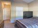 Bedroom with a neutral palette, showing a safe, and hallway at 348 Basswood Ct., Conway, SC 29526