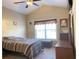 Cozy bedroom with ceiling fan, large window, and neutral color palette at 348 Basswood Ct., Conway, SC 29526