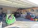Organized garage space with lawn mower and storage at 348 Basswood Ct., Conway, SC 29526