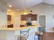 Open kitchen with breakfast bar seating, wood cabinets, and lots of counterspace at 348 Basswood Ct., Conway, SC 29526