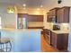 Spacious kitchen featuring stainless steel appliances, wood cabinetry, and a breakfast bar at 348 Basswood Ct., Conway, SC 29526