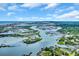 Stunning aerial view showcasing the waterfront property with lush waterways, docks, and coastal homes at 3659 Jordan Landing Rd., Murrells Inlet, SC 29576