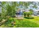 Lush backyard area with trees and patio at 3659 Jordan Landing Rd., Murrells Inlet, SC 29576