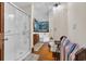 Bright bathroom with walk-in shower, jacuzzi tub, and charming coastal-themed mural at 3659 Jordan Landing Rd., Murrells Inlet, SC 29576