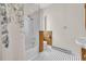 Bathroom with tiled shower/tub and patterned tile floor, complemented by wood-paneled accents and a window at 3659 Jordan Landing Rd., Murrells Inlet, SC 29576