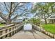 Waterfront boat ramp leading to scenic waterway views, framed by lush trees and showcasing waterfront homes at 3659 Jordan Landing Rd., Murrells Inlet, SC 29576