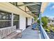 Inviting porch area with cozy bench seating and blue railing details at 3659 Jordan Landing Rd., Murrells Inlet, SC 29576