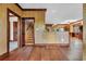Spacious living room with wood floors, staircase and views into the kitchen area at 3659 Jordan Landing Rd., Murrells Inlet, SC 29576
