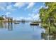 Scenic waterfront view with docks, gazebos, and tranquil water, offering picturesque coastal living at 3659 Jordan Landing Rd., Murrells Inlet, SC 29576