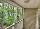 Comfortable outdoor balcony offering a relaxing view of the surrounding wooded area at 3677 Clay Pond Village Ln. # 6, Myrtle Beach, SC 29579