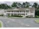 Exterior of a multi-story building with balconies and well-maintained landscaping at 3677 Clay Pond Village Ln. # 6, Myrtle Beach, SC 29579