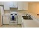 Close-up of kitchen with white appliances and lots of storage space at 3677 Clay Pond Village Ln. # 6, Myrtle Beach, SC 29579
