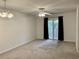 Living room featuring a ceiling fan and sliding glass door leading to a balcony at 3677 Clay Pond Village Ln. # 6, Myrtle Beach, SC 29579