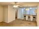 Spacious living room featuring a ceiling fan, bar top with stools, and an open concept to the kitchen at 3677 Clay Pond Village Ln. # 6, Myrtle Beach, SC 29579