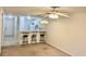Living room featuring a ceiling fan, bar top with stools, and an open concept to the kitchen at 3677 Clay Pond Village Ln. # 6, Myrtle Beach, SC 29579