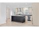Bright kitchen features stainless appliances, grey countertops, and dark island at 3759 Green Sea Rd., Green Sea, SC 29545