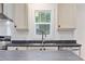 Bright kitchen features stainless appliances, grey countertops, and modern cabinetry at 3759 Green Sea Rd., Green Sea, SC 29545