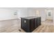 Bright kitchen features stainless appliances, grey countertops, and dark island at 3759 Green Sea Rd., Green Sea, SC 29545