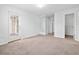 Bright bedroom featuring neutral carpeting, a closet, and a glass-paneled door to the exterior at 3762 Citation Way # 1023, Myrtle Beach, SC 29577