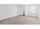 Bedroom featuring neutral carpeting, a closet, and a large window providing ample natural light at 3762 Citation Way # 1023, Myrtle Beach, SC 29577