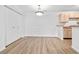 Dining area showcasing wood-look flooring, a ceiling light fixture, and access to the kitchen at 3762 Citation Way # 1023, Myrtle Beach, SC 29577