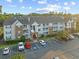 Aerial view of the building highlighting exterior architecture, balconies, and convenient parking spaces at 3762 Citation Way # 1023, Myrtle Beach, SC 29577