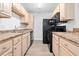 Efficient kitchen with light wood cabinets, laminate countertops, and stainless steel sink at 3762 Citation Way # 1023, Myrtle Beach, SC 29577