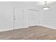 Bright living room with neutral paint, white trim and wood-look laminate flooring at 3762 Citation Way # 1023, Myrtle Beach, SC 29577