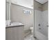 Bathroom featuring double sinks, wood-look floors, a window, and a shower/tub combo at 3768 Green Sea Rd., Green Sea, SC 29545