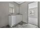 The bathroom features a double sink vanity and wood-look flooring with an open door at 3768 Green Sea Rd., Green Sea, SC 29545