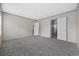 The bedroom offers neutral carpeting and multiple doors for closet and bathroom access at 3768 Green Sea Rd., Green Sea, SC 29545
