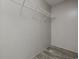 Walk-in closet with wire shelving and wood-look vinyl flooring at 3768 Green Sea Rd., Green Sea, SC 29545