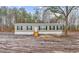 Exterior of a charming single story home with wooden porch and dark shutters at 3768 Green Sea Rd., Green Sea, SC 29545