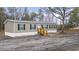 Exterior of a charming single story home with wooden porch and dark shutters at 3768 Green Sea Rd., Green Sea, SC 29545