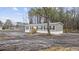 Exterior of a charming single story home with wooden porch and dark shutters at 3768 Green Sea Rd., Green Sea, SC 29545