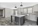 The kitchen boasts stainless steel appliances, wooden cabinetry, granite counters, and a center island at 3768 Green Sea Rd., Green Sea, SC 29545