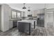 The kitchen boasts stainless steel appliances, wooden cabinetry, granite counters, and a center island at 3768 Green Sea Rd., Green Sea, SC 29545