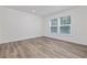 Bedroom filled with natural light from the window and laminate wood flooring at 3772 Green Sea Rd., Green Sea, SC 29545