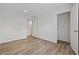 Open bedroom featuring laminate floors, access to additional rooms, and closet at 3772 Green Sea Rd., Green Sea, SC 29545