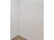 Small closet with laminate wood flooring and wire rack for ample storage space at 3772 Green Sea Rd., Green Sea, SC 29545
