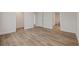 Hallway featuring neutral walls, laminate floors, and open access to rooms at 3772 Green Sea Rd., Green Sea, SC 29545
