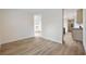 Spacious living area with laminate flooring leading to the kitchen and bedroom spaces at 3772 Green Sea Rd., Green Sea, SC 29545