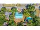 Aerial view of property showcasing lush landscaping, in-ground pool, and ample outdoor living space at 3926 Flagg St., Murrells Inlet, SC 29576