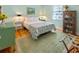 Bright bedroom with white furniture, colorful rug, hardwood floors and natural light from the window at 3926 Flagg St., Murrells Inlet, SC 29576