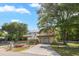 Inviting two-story home with a spacious deck, a white picket fence, and a well-manicured lawn at 3926 Flagg St., Murrells Inlet, SC 29576