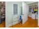 View of the laundry room with hardwood floors, shelving, and storage at 3926 Flagg St., Murrells Inlet, SC 29576