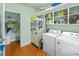 Laundry room featuring a washer, dryer, and ample storage shelving at 3926 Flagg St., Murrells Inlet, SC 29576