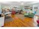 Spacious and inviting living area featuring hardwood floors, multiple seating areas, and natural light at 3926 Flagg St., Murrells Inlet, SC 29576