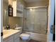 Bathroom with a white vanity, toilet, and shower with sliding glass doors at 398 Blue Stem Dr. # 59E, Pawleys Island, SC 29585